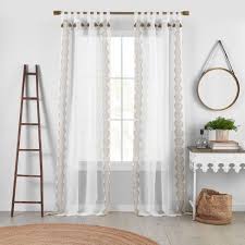 The tabs on tab top curtains are the exposed loops (tabs) of fabric that you can see on the curtains. Shilo Boho Sheer Tab Top Window Curtain Panel With Tassels 52 X 95 Linen Elrene Home Fashions Target