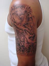 For example, hand tattoo designs are sometimes personal messages symbolizing family. Black And White Dove With Sun And Lettering Tattoo On Upper Arm Upper Arm Tattoos Arm Tattoos Black Tattoos For Guys