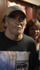 Can someone remove the person in the hat from a photo?