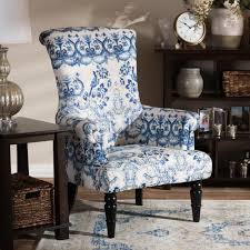 Contrasting Leg Designs And A Vivid Flower And Bird Print Distinguish This Contemporary Armchair Living Room O Upholstered Chairs Living Room Chairs Furniture