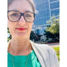 A semi-trailer belonging to Lloyd D. Nabors Demolition, LLC is parked  behind the Hertz Tower — formerly the Capital One Tower — as preliminary  demolition work