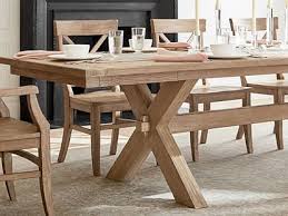 Surface is hand planed, showing small visible dents and carvings to resemble the look of salvaged lumber. Toscana Extending Dining Table Pottery Barn