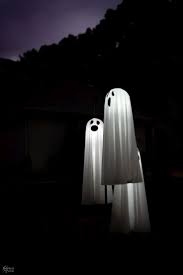 Easy Lighted Hanging Ghosts A Dollar Store Diy Halloween Outside Hanging Ghosts Halloween Outdoor Decorations