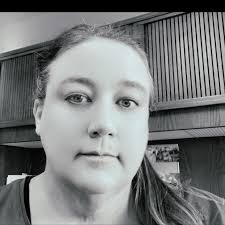 Should we visit the Badlands or Wall Drug first when traveling from  Mitchell?