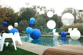 4k00.25huge chic beautiful white round like a ball inflated with helium expensive luxury balloons on the surface of the pool in a villa in a pine forest. Pool Decor Pool Party Big Balloons Shower Party