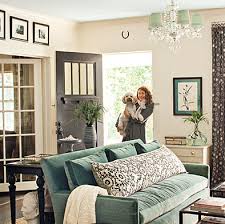 Teal Couch And Sea Green Accents Love The Couch Pillow And Chandelier Shades Home Home Decor Home Living Room