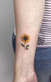 Potentially With A World Inside Love This So Much I D Probably Get It On The Back Of The Top Of My Arm Or Wher Sunflower Tattoos Cool Small Tattoos Tattoos