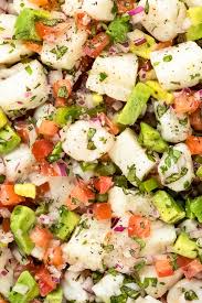 A simple shrimp ceviche for beginners made with poached shrimp instead of raw and finished with tomato, avocado, and cilantro. The Best Fish Ceviche Recipe No Spoon Necessary