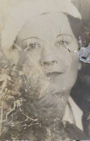 This is a photo of my granny as a pupil teacher aged 14 in 1910. She is  middle row at the far left. Could someone clear it up and take out the