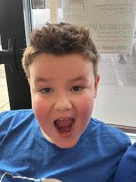 Zach had his very first haircut at Sports Clips (the “big kid haircut  place”), and he was feeling it! He requested the shampoo and the shoulder  massage and for his hair to “