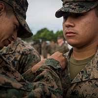 U.S. Navy Lt. Cmdr. Aaron Bernadette demonstrates the