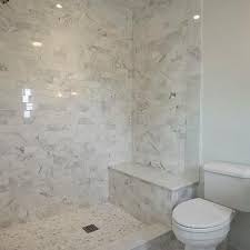 Less stark here because there is more white in the tile. Carrera Marble Shower Surround Design Ideas