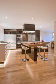 Design a kitchen island with seating that invites family members and guests to pull up a chair or stool and share conversation while you're cooking. L Shaped Kitchen Island Houzz