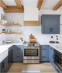 Both the walls and cabinets in this turquoise kitchen, designed by chad mcphail design, are bursting with vibrant color. Forever Classic Blue Kitchen Cabinets Centsational Style