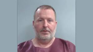 Man arrested after firing gun in UK parking garage