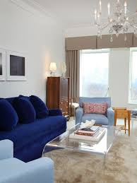 Exquisite Eclectic Family Room With Cool Blue Couch And Sky Blue Armchairs Also Acrylic Coffee Table And Beige Fur Rug Also M Ev Dekoru Koltuklar Kobalt Mavisi