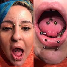 Double vertical new arrivals tongue piercing