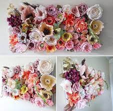 Adding some crepe paper flowers is a clever way to save a little bit of the cost while still maintaining an upscale look. Crepe Paper Flower Wall Art Handmade Flowers Paper Paper Flower Wall Art Paper Flowers Diy