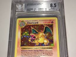 One pokemon charizard, beckett bccg 10, japanese neo 2 reverse holo promo #6 foil trading card condition previously owned, graded '10 mint or better' by bccg, outer edges of plastic casing have some minor sticker residue on front casing, also has some cracking on left lower side of casing, please see photos Pokemon Beckett Charizard Base Set Holo Shadowless Bgs