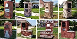 Decorative and functional brick mailbox with red bricks, white top and black metal box. Brick Mailboxes Mailbox Remedies