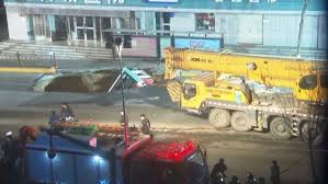 giant sinkhole swallows an entire bus