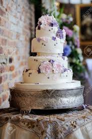 Wedding cake as tree trunk with carved c+t initials, mushrooms, moss, purple flowers. Wedding Cake At Reception With Pink And Purple Flower Decoration Stock Photo Picture And Royalty Free Image Image 21956600