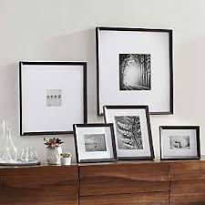 Decorating with frames ~ a fun way to add texture and dimension to a wall is by layering picture frames. Picture Frames For Photos And Wall Art Crate And Barrel