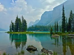 My favourite location on the planet. Spirit Island in Banff National Park  in Canada. The haze in the photo is from the Fort McMurray wildfires.  [4032x3024] [OC] : rEarthPorn