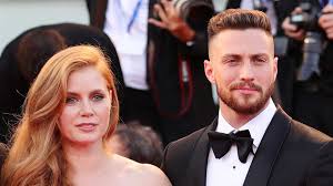 Wearing a grimy grey sweatshirt. Aaron Taylor Johnson Puts Abs On Full Display Says Oscars Snub Was A Relief Entertainment Tonight