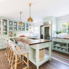 The forest green past the kitchen island and cabinetries while some appliances like range and refrigerator are made up of stainless steel. Mint Green Kitchen Island Design Ideas