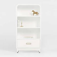 This bookcase is ideal for a small dwelling, and allows for both display and concealed storage. White Bookcases Crate And Barrel