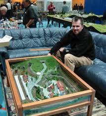 Hape e3766 70 piece railway train table and set toy with battery powered locomotive with removable playmat surface and storage for kids 3 years and up. Img Model Train Table Model Train Layouts Model Railway Track Plans
