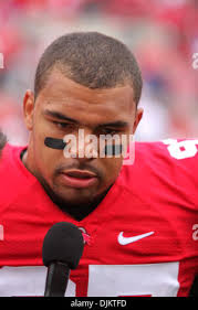 Ohio State's Cameron Heyward (97) andTodd Denlinger (92) sack Penn State  quarterback Daryll Clark (17) during the first half of an NCAA college  football game in State College, Pa., Saturday, Nov. 7,