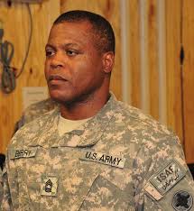 U.S. Army Master Sgt. Christopher Berry stands at attention