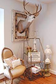 There's nothing like the timeless, classic look offered by rustic decor. Love The Frame Around The Deer Head Hunting Themed Bedroom Deer Heads Living Room Deer Head Decor