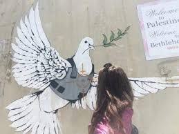 World renowned artist banksy has teamed up with love welcomes to commission refugee women to hand sew mats using life vests found on lesvos beaches. Banksy S Palestine Where To Find Banksy Street Art In The West Bank