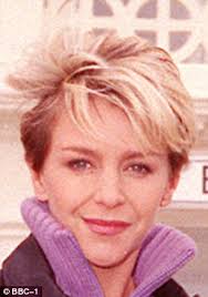 Dressed down Leslie Ash jokingly brandishes her walking stick during rare  outing in London