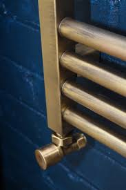 Our bathroom accessories category offers a great selection of towel warmers and more. Midas Brushed Brass Finish Towel Rail By Feature Radiators Archello