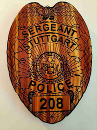 Artists gift plaques to honor fallen Sgt. Donald Scoby; radio call number  retired by department in remembrance