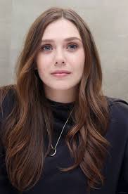 The remake of the hit science fiction film godzilla is set to hit theaters this may and fans of the franchise couldn't be more excited. May 4 Godzilla Press Conference 009 Elizabeth Olsen Source Photo Archive