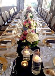 Navy And Gold Wedding Table Decor With White And Pink Flowers Gold Chargers And Floating Candles A Wedding Table Wedding Centerpieces Wedding Table Settings