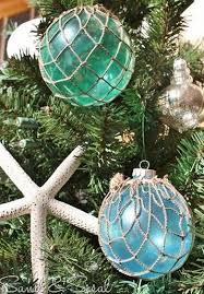 We love coastal christmas trees because they are perfect for a nautical, tropical, or ocean themed house. 13 Homemade Coastal Xmas Ornaments To Make Coastal Christmas Decor Beach Christmas Christmas Tree Themes