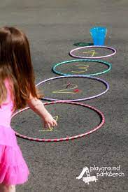The child to ring the item or get the closest is the winner. 5 Action Packed Hula Hoop Games For Kids Sports Games For Kids Hula Hoop Games Hoop Games