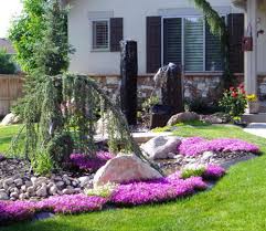 Front yard will become the main point of all people who enter your home for the first time. Small Garden Yard With Cute Purple Plants Front Yard Landscaping Design Front Garden Design Small Front Yard Landscaping