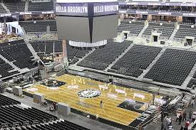 The white tiling that hugs the sidelines is the same tiling that hugs. The Brooklyn Nets Reveal Their New Herringbone Patterned Home Court Photos Brooklyn Nets Nba Arenas Arena Sport