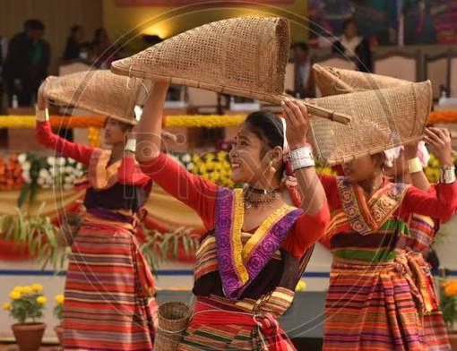 Image of Artists perform a traditional dance during the Bodoland Territorial Council oath-taking ceremony at Greenfield, in Kokrajhar District of Assam on December 15, 2020-EE686931-Picxy