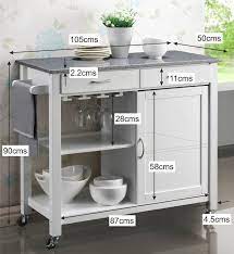 Maynard indoor glass paneled kitchen cart with wheels by christopher knight home. Harrogate White Painted Hevea Hardwood Kitchen Trolley Island With Grey Granite Top Large Island Ca Kitchen Tops Granite Kitchen Trolley Granite Kitchen Island