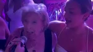 Grandma defies predictions to party at granddaughter's wedding she  "wouldn't see"