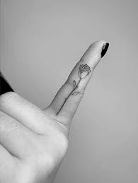 Fine Line Rose Tattoo On The Left Index Finger Finger Rose Tattoo Finger Tattoos Tiny Finger Tattoos