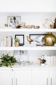 Maybe you would like to learn more about one of these? 7 Dreamy Golden Touches That Give A Modern Vibe To A Home Styled Living Room Shelves White And Gol Living Room Shelves Open Shelving Living Room Designs